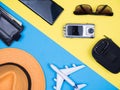 Flat lay top view of traveler kit for holiday over blue background Royalty Free Stock Photo