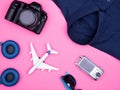 Flat lay top view of traveler photographer accessories on pink background Royalty Free Stock Photo