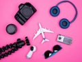 Flat lay top view of traveler photographer accessories on pink background Royalty Free Stock Photo