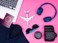 Flat lay top view of traveler photographer accessories on pink background Royalty Free Stock Photo