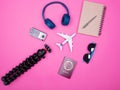 Flat lay top view of traveler photographer accessories on pink background Royalty Free Stock Photo
