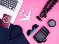 Flat lay top view of traveler photographer accessories on pink background Royalty Free Stock Photo