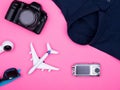 Flat lay top view of traveler photographer accessories on pink background Royalty Free Stock Photo