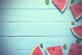 Flat lay top view watermelon slice, with mints which is a summer fruit on blue wooden table background copy space