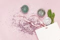 Flat lay top view White gift bag holographic glitter confetti Vintage Christmas New Year balls green pine branches on pink Royalty Free Stock Photo