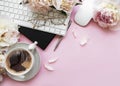 Flat lay top view women`s office desk with flowers. Female workspace with laptop, flowers peonies, accessories, notebook, glasses Royalty Free Stock Photo