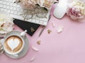 Flat lay top view women`s office desk with flowers. Female workspace with laptop, flowers peonies, accessories, notebook, glasses Royalty Free Stock Photo