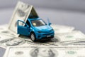 flat lay toy car, toy house, keys and money on the table Royalty Free Stock Photo