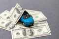 flat lay toy car, toy house, keys and money on the table Royalty Free Stock Photo