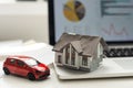 flat lay toy car, toy house, keys and money on the table Royalty Free Stock Photo