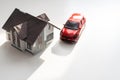 flat lay toy car, toy house, keys and money on the table Royalty Free Stock Photo