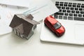 flat lay toy car, toy house, keys and money on the table Royalty Free Stock Photo