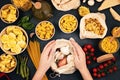 Flat lay with tradiotional organic italian pasta and cooking ingredients in reusable cotton bags and glass containers. Zero waste, Royalty Free Stock Photo