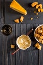 Flat lay. Traditional french cheese fondue. Crouton dipped into hot cheese fondue on a long-stemmed fork. Royalty Free Stock Photo