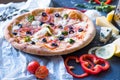 Flat lay with traditional Italian pizza with salmon, broccoli and philadelphia cheese on black stone table Royalty Free Stock Photo