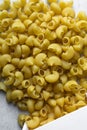 Flat lay of uncooked pipe rigate pasta, top view of pipe rigate pasta shells