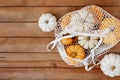 Flat lay varied Pumpkins on wooden background. Autumn cozy concept,