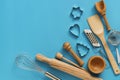 Flat lay variety of kitchen utensils for cooking on a blue background. Top view, copy space Royalty Free Stock Photo