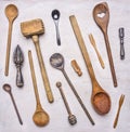 Flat lay variety of wooden cutlery, spoons, forks, meat beater wooden rustic background top view close up Royalty Free Stock Photo