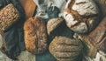 Flat-lay of various bread loaves, top view, wide composition Royalty Free Stock Photo