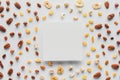 flat lay with various dried fruits and nuts with copy space in center