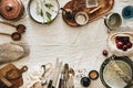 Various kitchen utensils and tablewear over linen tablecloth, copy space Royalty Free Stock Photo