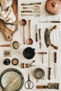 Various kitchen utensils and tablewear over linen tablecloth, vertical composition Royalty Free Stock Photo