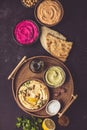 Flat-lay of Various Vegetarian dips hummus