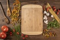 Flat lay of vegetables and pasta and a chopping table Royalty Free Stock Photo