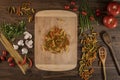 Flat lay of vegetables and pasta and a chopping table Royalty Free Stock Photo