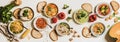 Flat-lay of vegetarian creamy homemade soup in plates with bread