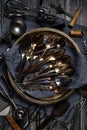 Top down view of an abstract arrangement of antique utensils against a dark background. Royalty Free Stock Photo