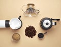 Flat lay view of modern coffee brewing essentials including beans grinder kettle and pour over Royalty Free Stock Photo