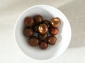 Flat lay view of rare Black Krim heirloom tomatoes in white bowl Royalty Free Stock Photo