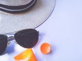 Flat lay view of summer and travel accessories. Hat, sun glasses, sunblock cream protection.