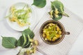 Flat lay view of Tilia platyphyllos known as large-leaved linden blossom herbal tea made out of an freshly picked blossoms .