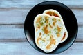 Flat lay view of traditional Indian Naan flatbread