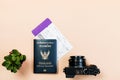 Flat lay of vintage digital compact camera with Thailand official passport, boarding pass, and small cactus Royalty Free Stock Photo