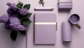 Flat lay of violet notebook, pen, lilac flowers on purple background