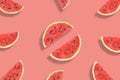 Flat lay of watermelon half slices on pink background. Watermelon pattern