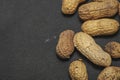 flat lay wave shape of roasted unsalted peanuts, peanuts in skin and peanuts in shell, food ingredients, Arachis