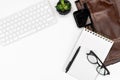 Flat-lay White office desk table layout. computer keyboard, glasses, coffee, notebook and laptop case. copy space layout Royalty Free Stock Photo