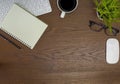 Flat lay, White office desk table. View from above with keyboard, computer mouse, pen, notebooks, eyeglasses and cup of black coff Royalty Free Stock Photo