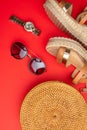 Flat lay, Wicker fashion bag, sunglasses, and expensive watches and women`s shoes. Summer fashion, the concept of a holiday. On a Royalty Free Stock Photo