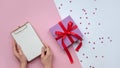 Flat lay. Woman`s hands paper. To-do list. Christmas ideas, notes, goals or plan writing concept. Valentine`s Day. Royalty Free Stock Photo