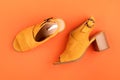 Flat lay with woman summer yellow shoes color over orange leather textured background. Fashion, online beauty blog, summer style,
