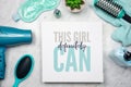 Flat lay of women`s beauty products with inspirational quote