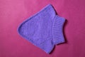 Flat lay woolen winter clothing. Top view lilac sweater