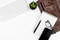 Flat-lay of working or writing place. layout. keyboard, glasses, smartphone, notebook and laptop case. copy space Royalty Free Stock Photo