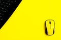 flat lay workspace black keyboard, yellow computer mouse Royalty Free Stock Photo
